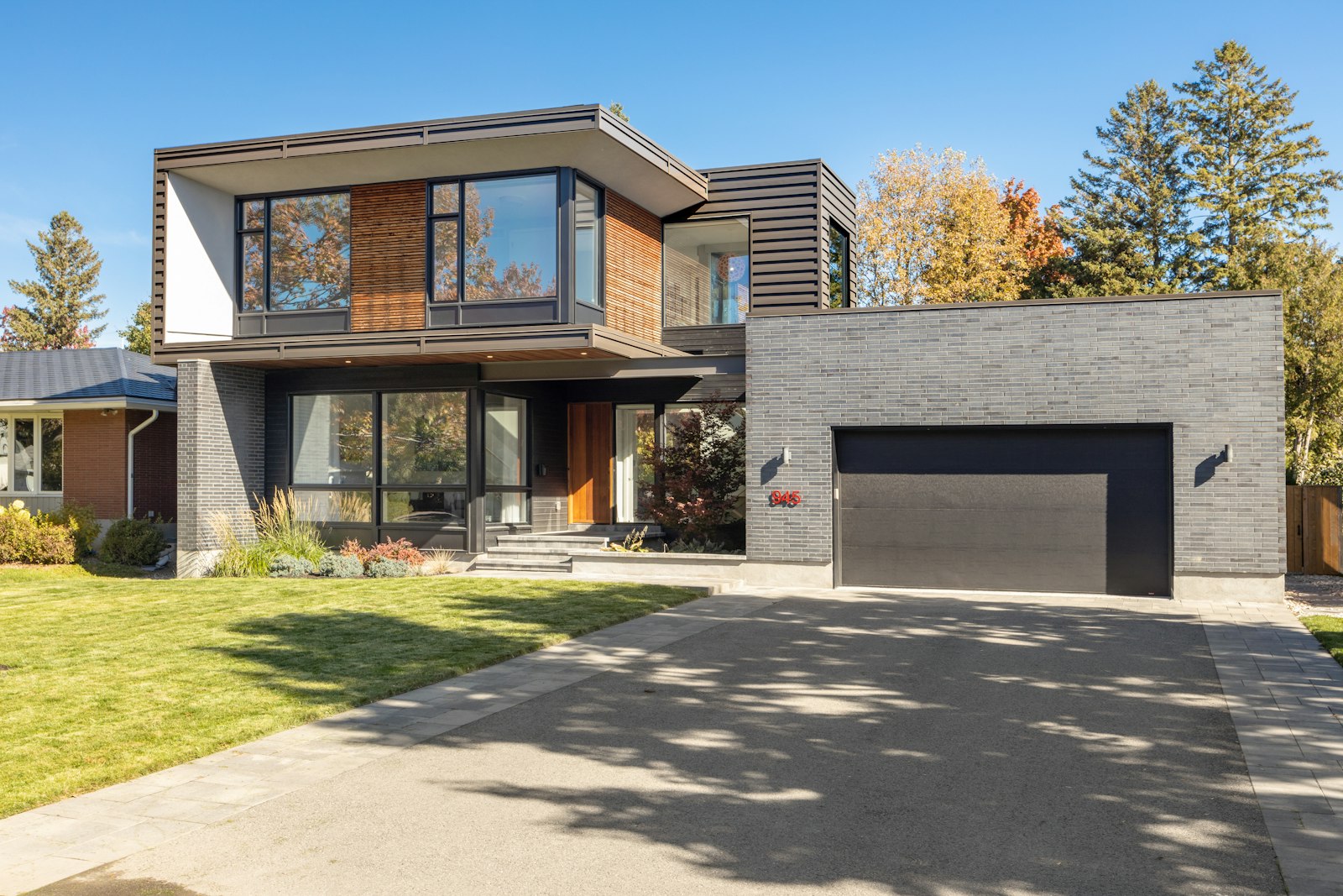 A modern home with a driveway, the asset that earns